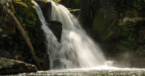 Waterfall pouring into a pond in Cades Cove