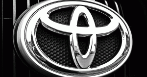 Close-up of a Toyota insignia on the front of a 2016 Toyota Corrola 